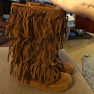 Knee high fringe boots. Size 9. Zips up the side.